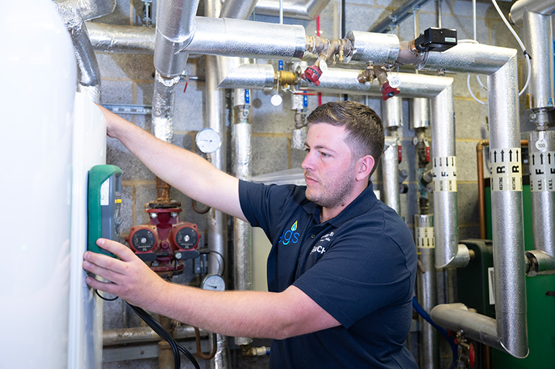 Engineer running checks on a commercial installation